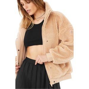 Alo Yoga Sherpa Varsity Jacket in Camel